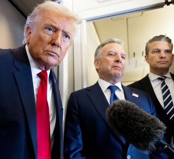 US President Donald Trump speaks with the media as Defense Secretary Pete Hegseth (R) and special envoy Steve Witkoff (C) look on aboard Air Force One during a flight from Dover, Delaware, to Miami, Florida, on March 7, 2026. (Photo by SAUL LOEB / AFP via Getty Images)