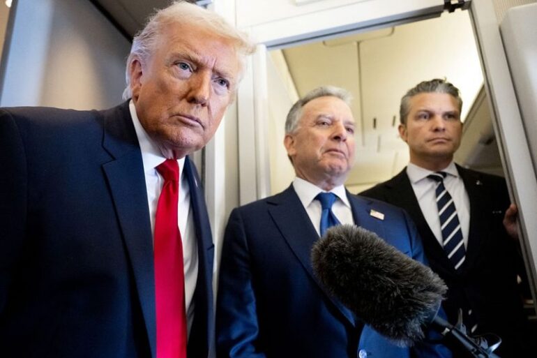 US President Donald Trump speaks with the media as Defense Secretary Pete Hegseth (R) and special envoy Steve Witkoff (C) look on aboard Air Force One during a flight from Dover, Delaware, to Miami, Florida, on March 7, 2026. (Photo by SAUL LOEB / AFP via Getty Images)