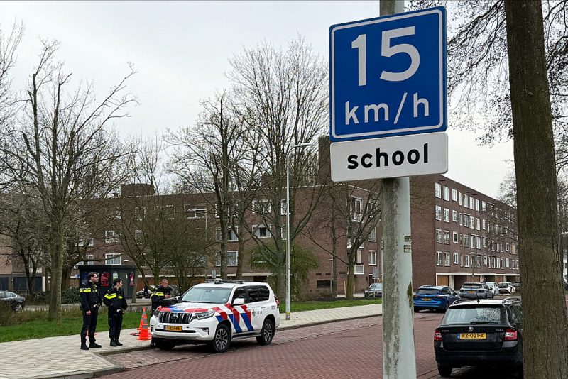 A photograph taken on March 14, 2026 shows a police car parked outside a Jewish school, in Amsterdam, where an explosion was reported overnight. An overnight blast against an exterior wall of a Jewish school in Amsterdam did not cause any injuries, Mayor Femke Halsema said on March 14, denouncing "a cowardly act of aggression". An investigation has been opened and the incident comes after nighttime attacks this week in front of synagogues in the Belgian city of Liege and the Dutch port city of Rotterdam. (Photo by Stéphanie HAMEL / AFP via Getty Images)