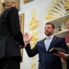 WASHINGTON, DC - MARCH 24: U.S. Attorney General Pam Bondi swears in former U.S. Sen. Markwayne Mullin (R-OK) as the next secretary of the Department of Homeland Security as his wife Christie Mullin holds a bible in the Oval Office at the White House on March 24, 2026 in Washington, DC. Mullin takes the helm of DHS during a challenging time as it has been partially shut down since February 14 while lawmakers negotiate reforms for Immigration and Customs Enforcement. (Photo by Chip Somodevilla/Getty Images)