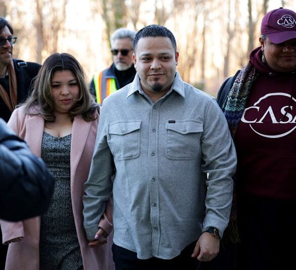 GREENBELT, MARYLAND - DECEMBER 22: Kilmar Abrego Garcia arrives with his wife Jennifer Vasquez Sura and his attorney Simon Sandoval-Moshenberg (L) at U.S. District Court for the District of Maryland on December 22, 2025 in Greenbelt, Maryland. Abrego Garcia, a longtime Maryland resident who was deported to the high-security CECOT prison in El Salvador, then sent back to the U.S. and released after the court found his detention unlawful, attended a hearing on whether Immigration and Customs Enforcement (ICE) may re-detain him. (Photo by Alex Wong/Getty Images)