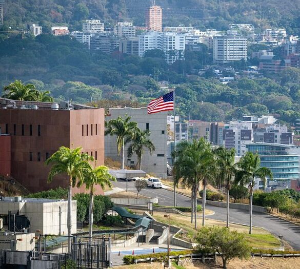 TOPSHOT - The US flag flutters at the US embassy in Caracas on March 14, 2026, ten days after the restoration of diplomatic relations following the capture of ousted leader Nicolas Maduro in a US military raid. (Photo by Maryorin Mendez / AFP via Getty Images)
