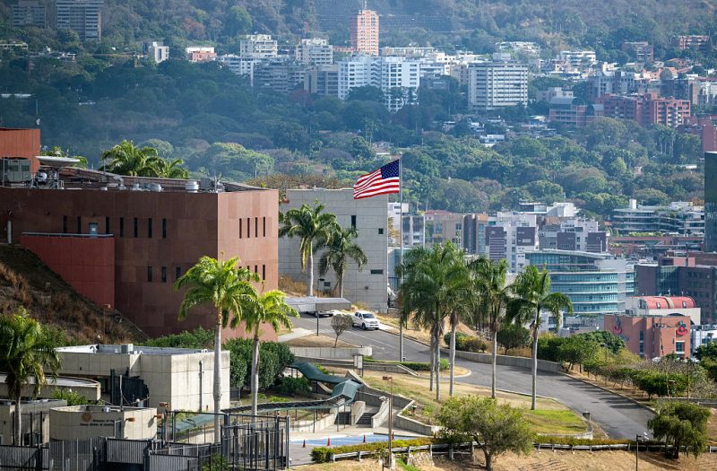 TOPSHOT - The US flag flutters at the US embassy in Caracas on March 14, 2026, ten days after the restoration of diplomatic relations following the capture of ousted leader Nicolas Maduro in a US military raid. (Photo by Maryorin Mendez / AFP via Getty Images)