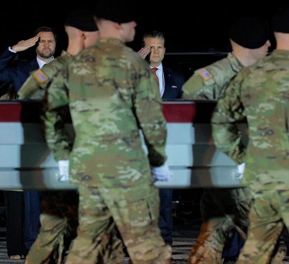 DOVER, DELAWARE - MARCH 09: U.S. Vice President JD Vance and U.S. Secretary of War Pete Hegseth, salutes as a U.S. Army carry team moves a flag-draped transfer case containing the remains of Army Sgt. Benjamin N. Pennington at Dover Air Force Base on March 9, 2026 in Dover, Delaware. Pennington died of injuries sustained from an Iranian attack on Prince Sultan Air Base in Saudi Arabia on March 1. (Photo by Chip Somodevilla/Getty Images)