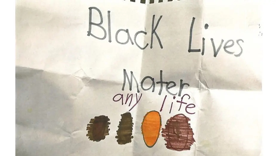 Illustration of a child's drawing with "Black Lives Mater any life" written in marker and three brown/orange colored ovals.