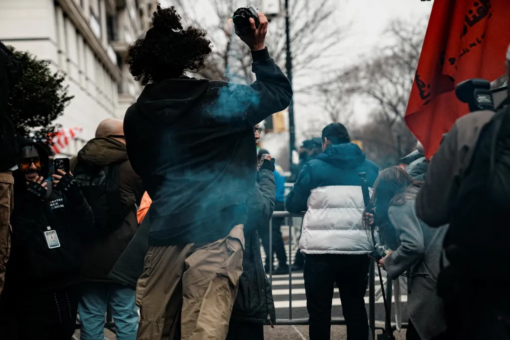 A suspect throws a handmade explosive at supporters of U.S. President Donald Trump during a rally to stop public Muslim prayer, in New York City, U.S., March 7, 2026.