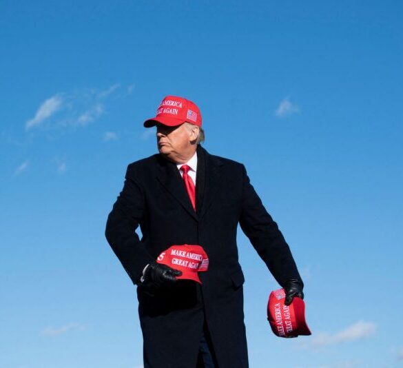 TOPSHOT - US President Donald Trump throws hats to supporters during a Make America Great Again rally at Wilkes-Barre Scranton International Airport November 2, 2020, in Avoca, Pennsylvania. The US presidential campaign enters its final day Monday with a last-minute scramble for votes by Donald Trump and Joe Biden, drawing to a close an extraordinary race that has put a pandemic-stricken country on edge. (Photo by Brendan Smialowski / AFP) (Photo by BRENDAN SMIALOWSKI/AFP via Getty Images)