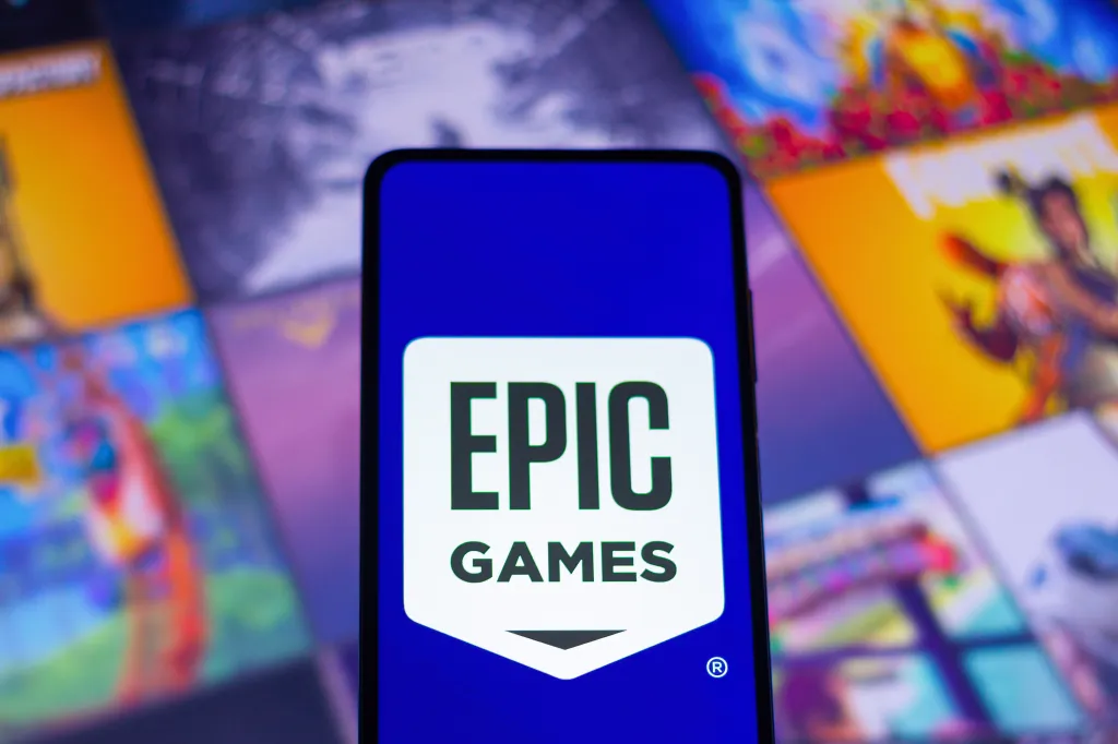 Illustration of the Epic Games logo displayed on a smartphone.