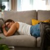 Experts caution against sleeping on the couch, especially if it's more of a habit.